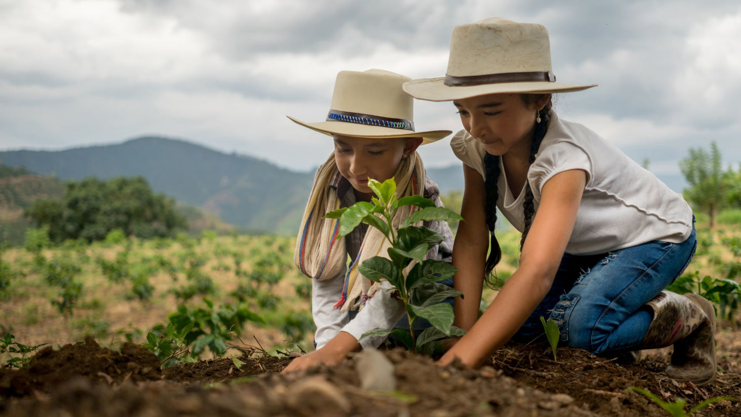 two girls gardening